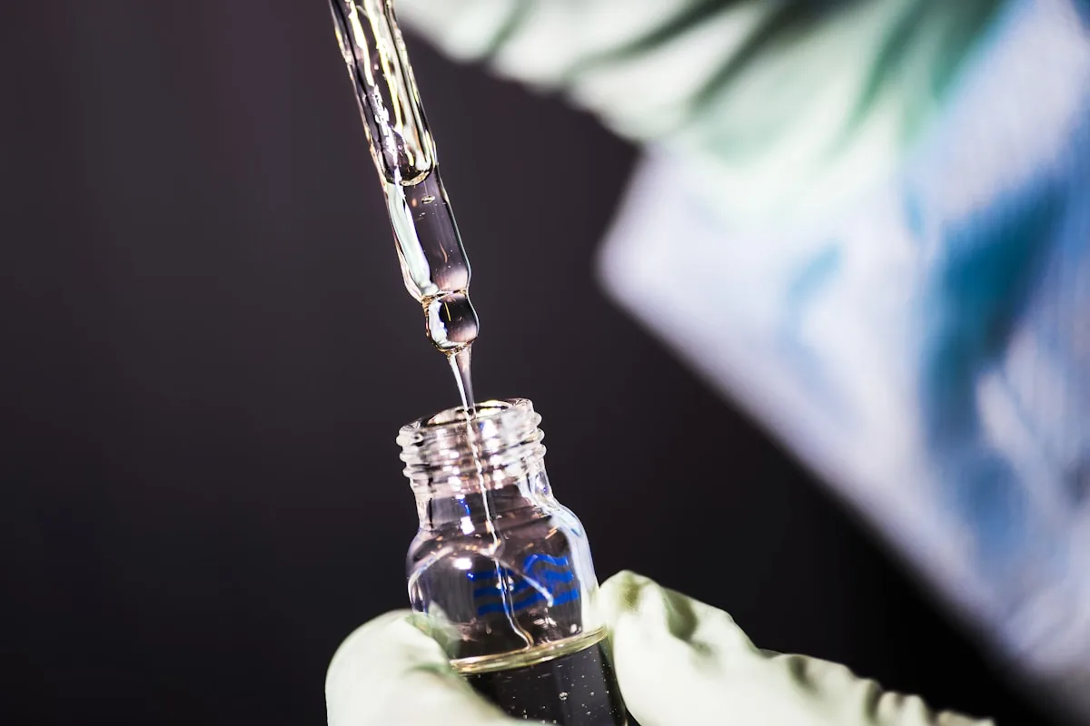 Laboratory technician pipetting a sample